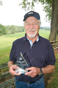photo of Doug Dennis with award